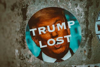 Sign with Trump’s face and “Trump Lost” written on it