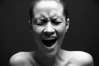 black and white closeup, woman screaming, eyes closed