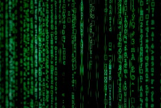 Miscellaneous green ASCII symbols in a seaming cascade against a black background, symbolizing information flow on the internet.