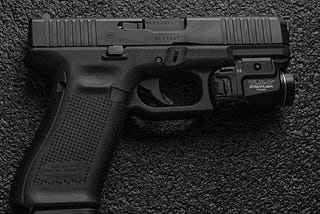 Glock 45 handgun with under barrel light