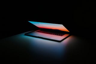 Section intro image of a half open computer to set the stage for portfolio resources