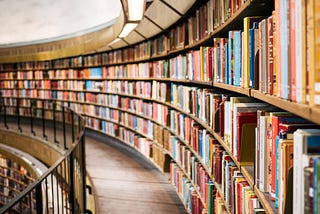 Curved rows of bookshelves in a library