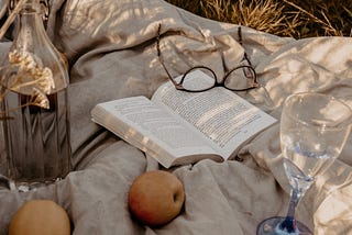 Reading poetry during a picnic.