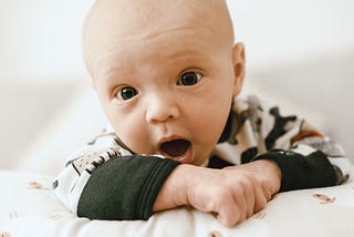 Baby making a surprised face.