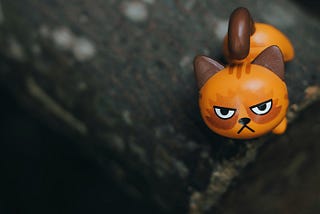 A toy cat with an angry face