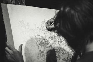 black-and-white photo of person drawing