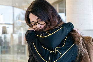 A woman hugging herself