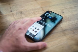 Scrolling social media on a smartphone.