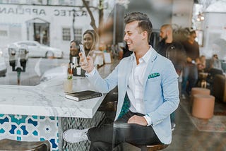 Man smiling at phone