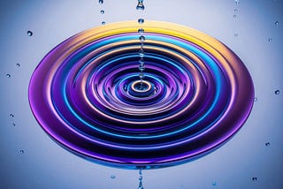 A swirling vortex of colorful liquid suspended in mid-air, with small droplets shimmering and floating around it