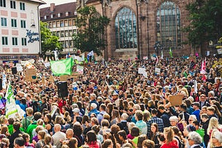A large crowd of protesters in daylight.