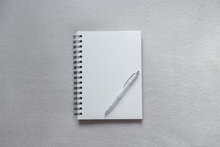 A pen placed on a note pad