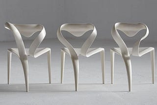 8 sculptural chairs entirely made of wood