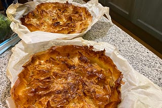 3 pies with golden brown crusts on a counter