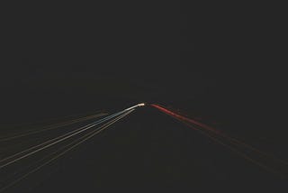 dark road with little guiding light