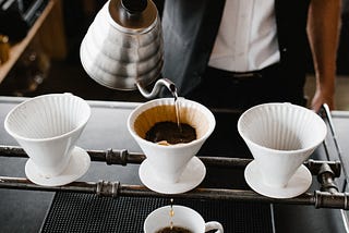 Servant preparing a pour-over coffee