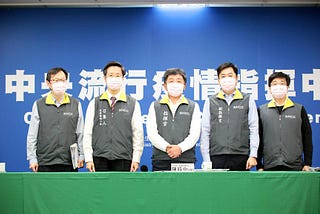 Taiwan’s ministers at a press conference wearing pink face masks, as part of a deliberate campaign to de-gender the colour.