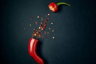 Spicy pepper symbolizing spicy writing in romance and other genres.