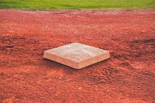 Open base on infield dirt of a baseball field