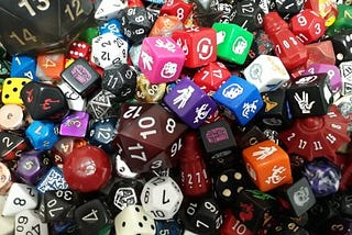 a pile of multi-coloured and multi-sided dice