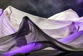 Dancers under silk sheets