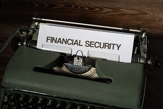 A typwriter with a page in it with a heading as Financial Security