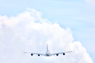 Airplane flying into the clouds