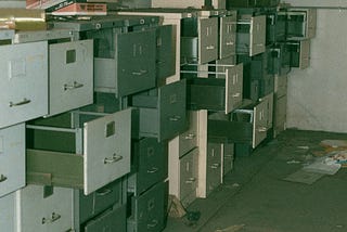 a photo of stacked old metal filing cabinets