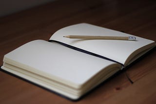 A journal with a pencil