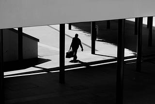 Here is a photo of a man walking, attending to his daily responsibilities, doing what is right, sharing a spirit of goodness, and exhibiting a spiritual awareness.