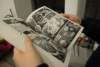 A person reading the manga Akira