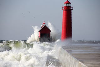 picture of a lighthouse and crashing waves