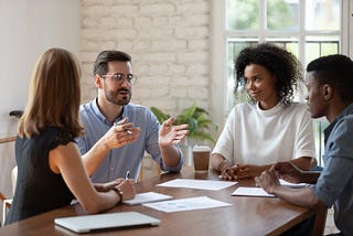 group of people discussing hiring in HR