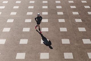 man running across patio