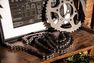 Conveyor chain and gear on a wooden platform