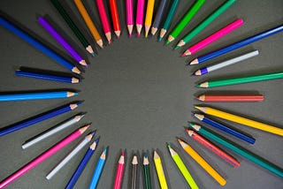 multicolored pencils arranged in a circle