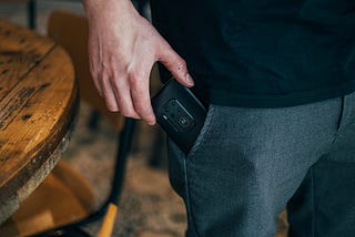 Man putting a phone in his pocket