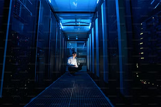 a server center with a person working on a computer