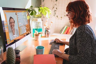 Woman running a SaaS demo from a home office