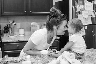 Mom and daughter in kitchen black and white photo lifestyle