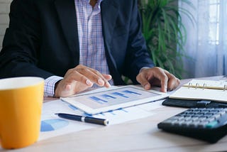 Image of a person working on ipad