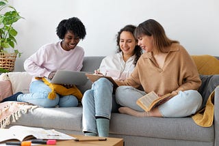 Three flatmate sitting on couch and talking
