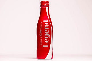 Special Edition Of A Coca Cola Bottle With Word Legend Written On It.