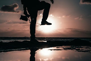 Silhouette of a man stepping.