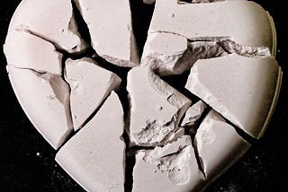 A white colored heart in pieces