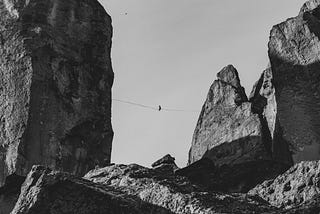 A high wire between two huge rocks