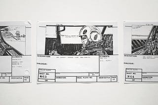 Storyboards for a film, with a sketch of a man in a helmet sitting in the cockpit of a plane.