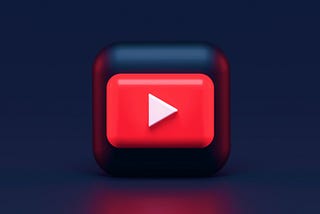 YouTube logo in front of a dark background