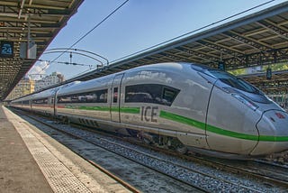A gray version with a green line of the TGV at a station!
