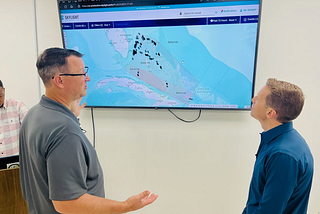 A member of WildAid shows CBS’ Ben Tracy the Skylight interface.